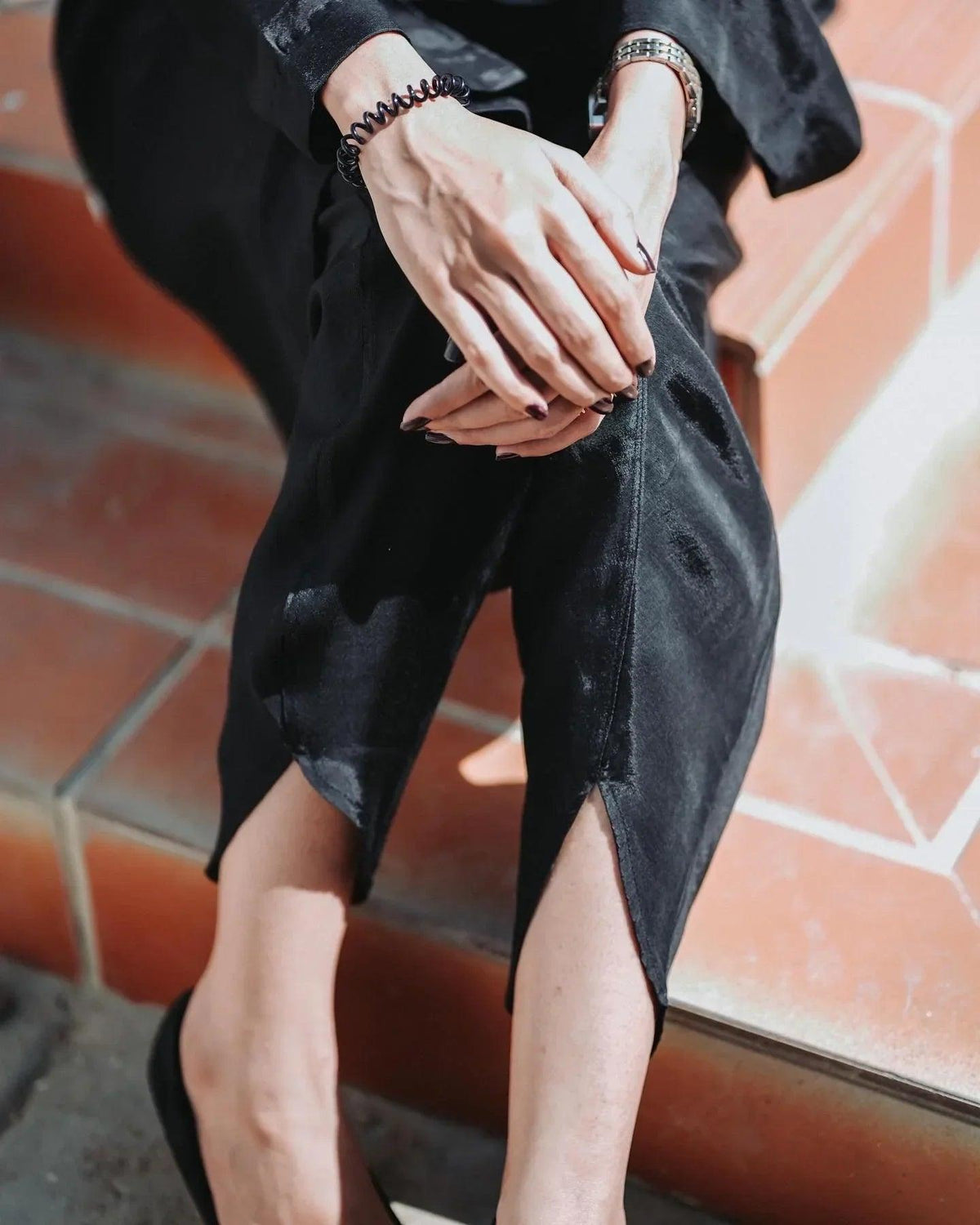 Close up on the trouser of black dress.
