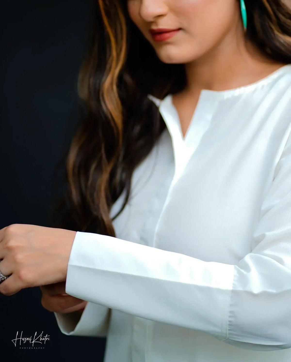 Close up of the women wearing a white dress.