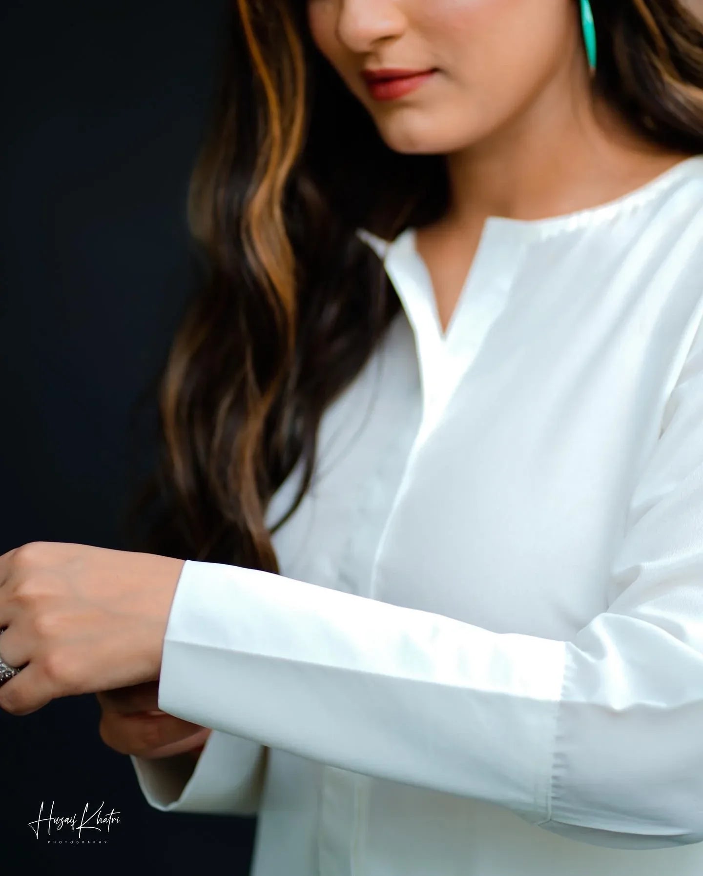 Close up of the women wearing a white dress.