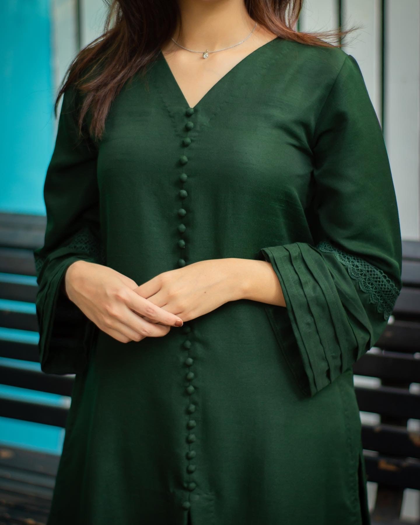 Close up of the bottle green dress.