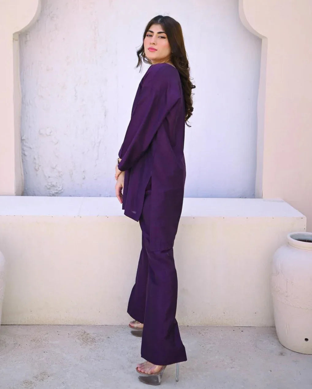 A women wearing a purple dress.