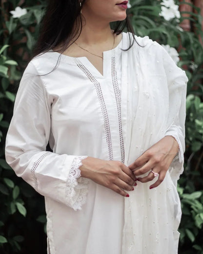 Close up on the details of embroidery on sleeves and neck line details.