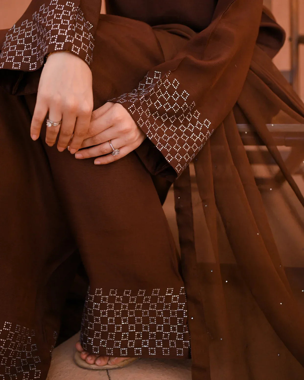 close up of a rawsilk dress and chiffon dupatta. Stone work on dress and dupata.
