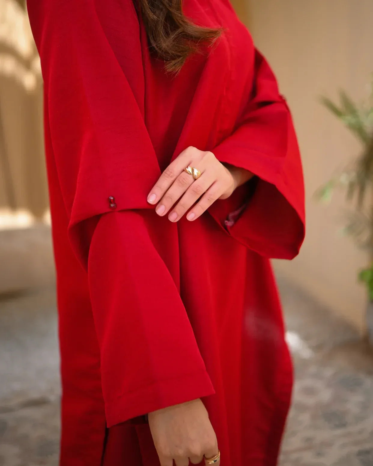 Close up of a red two piece dress sleeve details.