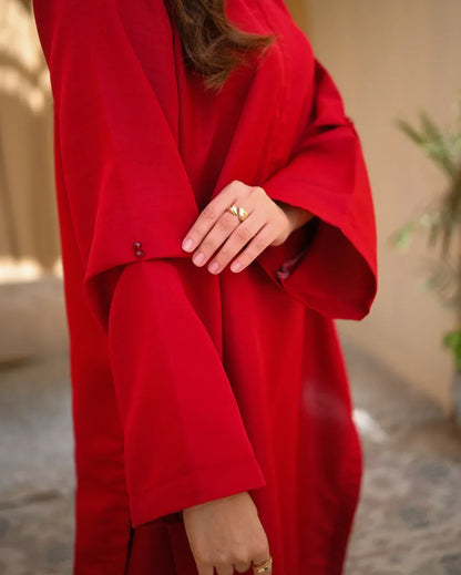 Close up of a red two piece dress sleeve details.