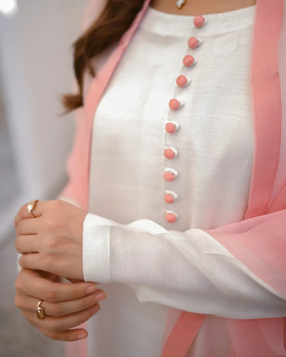 close up of a rawsilk white dress.