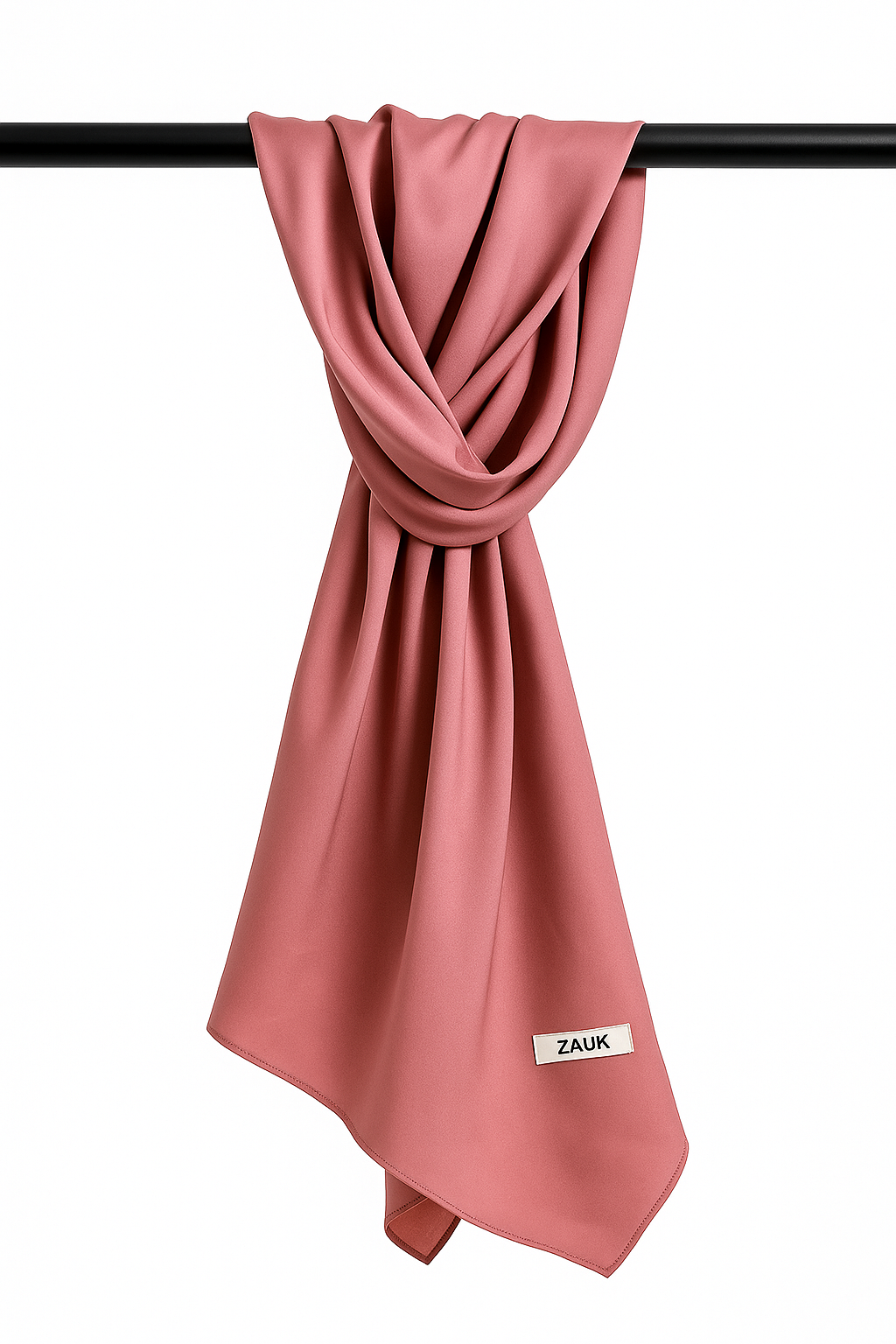 Tea Pink scarf with 'ZAUK' label draped over a black bar on a white background