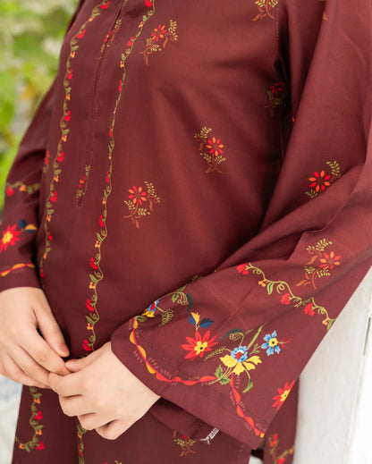 Maroon fabric with colorful floral print.